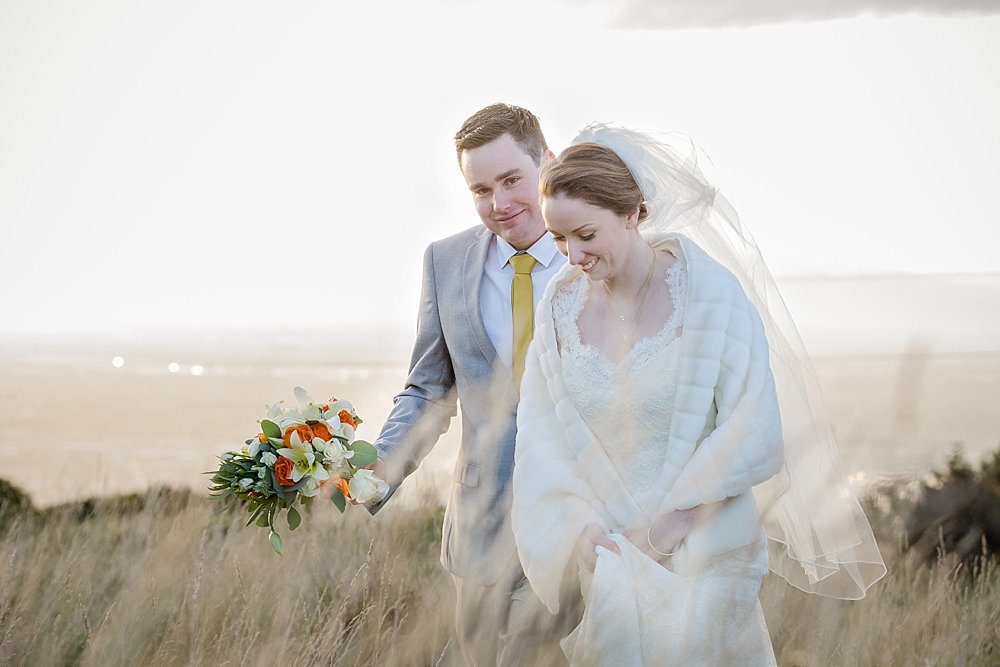 Melton Estate Wedding-Bride and groom take a walk on the Porthills
