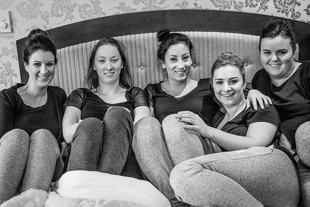 Melton Estate Wedding-Bridesmaids relaxing on bed 
