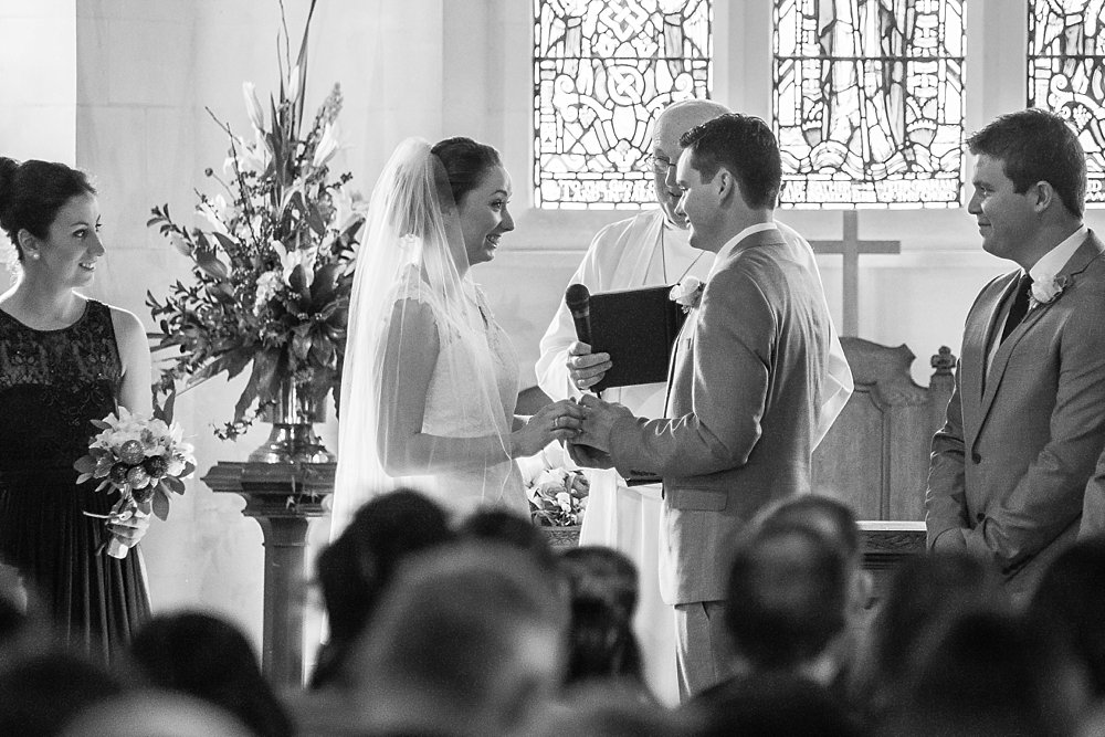 Melton Estate Wedding-Church photo of the bride and groom holding hands