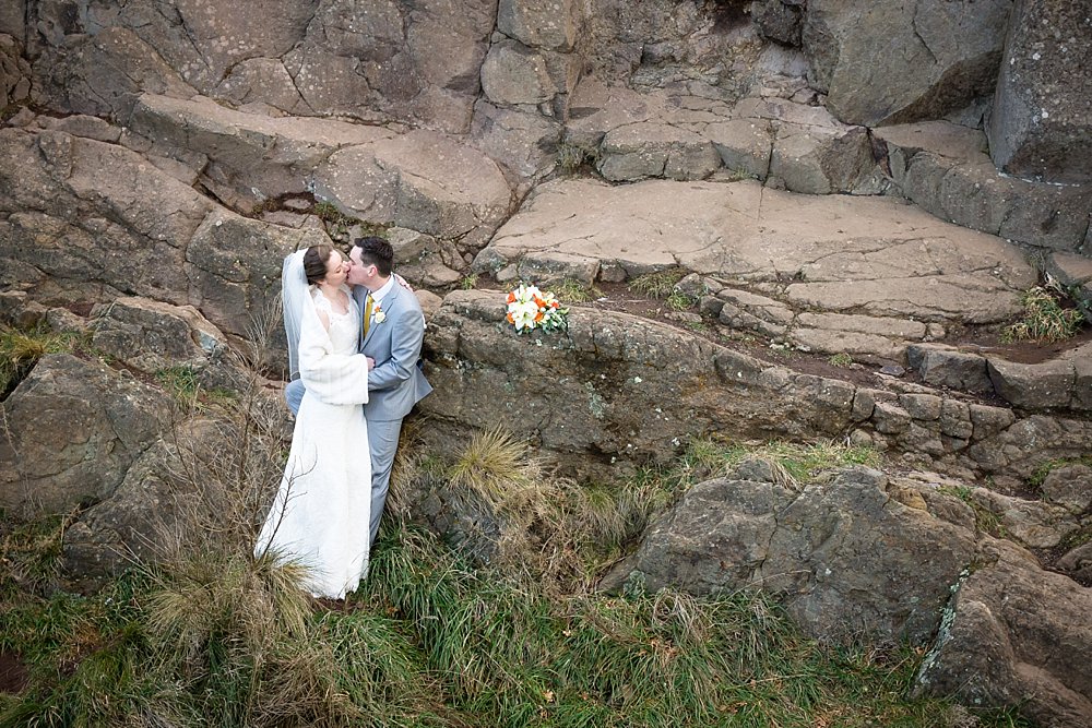 Melton Estate Wedding-bride and groom with rock boulders background