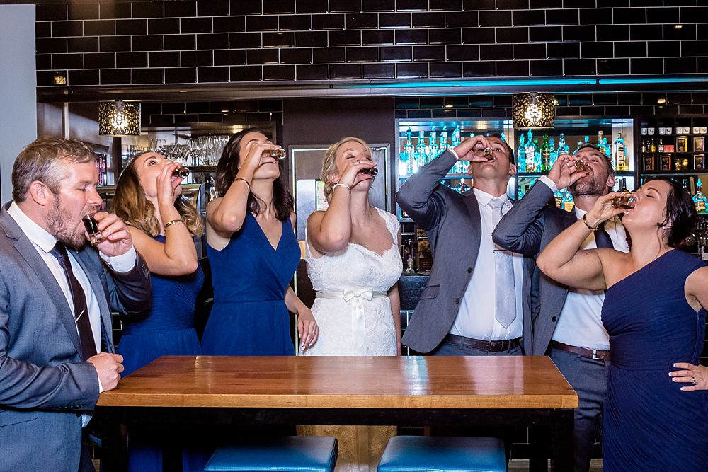 The Gym Art Centre Wedding-Bridal party take a shot of sambuca at local bar 