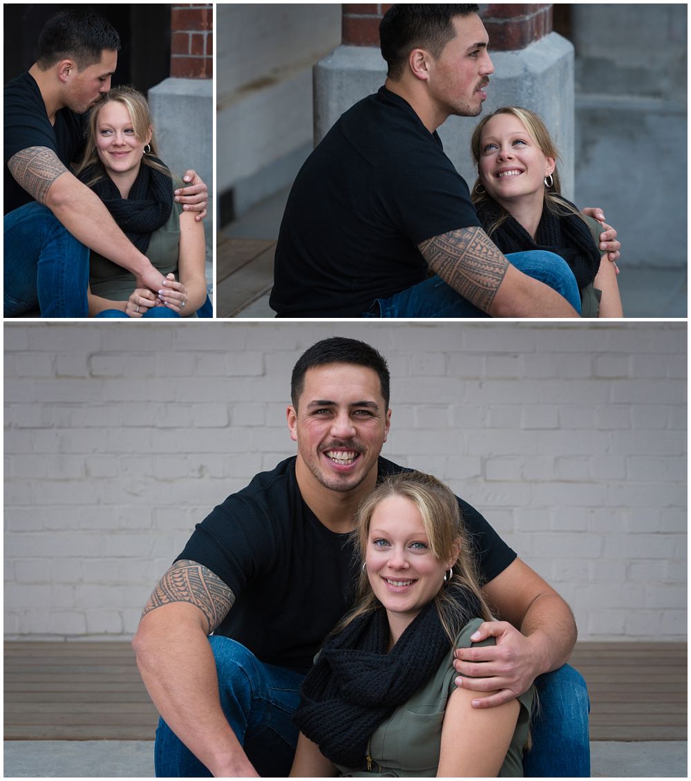 Engaged couple sitting on porch